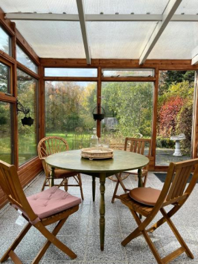 House with a magical garden and sunroom